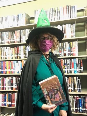 Charlotte at the Burnsville Library in costume on yet another day to hand out Summer Reading Packets!