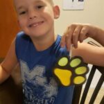 This is Mikey from Tishomingo. Mikey finished his paw print craft.