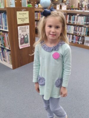 Booneville patron during NLW wearing the button she designed.