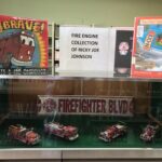 Four antique replica fire engines belonging to Ricky Joe Johnson are on display at the Burnsville Library.