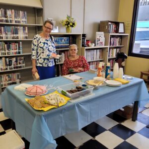 Joyce enjoying some refreshments at the Tishomingo Library for Patron Appreciation Day. Also pictured is Jorja, Friends of the Library.