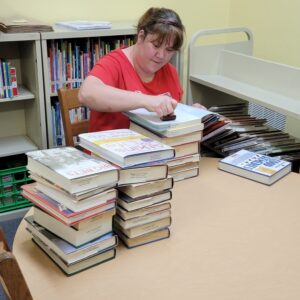 Sarah is volunteering her time during National Library Week at Tishomingo Library.
