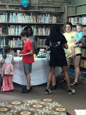 Burnsville Public Library’s 3rd SRP, with Master Gardener Lena Mitchell and assistant T’kyra Young spoke about plants and instructed how to plant and care for the seeds each participant was given to plant in a container of soil.  The participants enjoyed planting and watering their seeds and were also provided extra packages of seeds to take home and plant in their soil. It was both educational and FUN! Thanks to the presenters and also to the participants. Our next SRP here at Burnsville Public Library is scheduled for July 31 beginning at 12:30 and the subject theme is to be self affirmation, because sometimes we all need encouragement.
