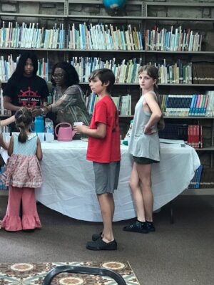 Burnsville Public Library’s 3rd SRP, with Master Gardener Lena Mitchell and assistant T’kyra Young spoke about plants and instructed how to plant and care for the seeds each participant was given to plant in a container of soil.  The participants enjoyed planting and watering their seeds and were also provided extra packages of seeds to take home and plant in their soil. It was both educational and FUN! Thanks to the presenters and also to the participants. Our next SRP here at Burnsville Public Library is scheduled for July 31 beginning at 12:30 and the subject theme is to be self affirmation, because sometimes we all need encouragement.