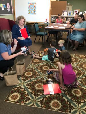 Burnsville 2nd SRP, Representatives from FANB explained how to save money, read a story related to this topic from the U.S. Currency Education for kids (donated by a patron) and gave out never circulated State quarters along with goody bags filled with other fun items.  The library was supplied with several of the currency books by our patron and we were able to hand out these books to our SRP participants.
