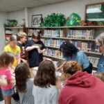 Lena Mitchell from the Master Gardners presented a program about seeds at the BE Library on June 27th. She instructed the children on how to plant seeds.